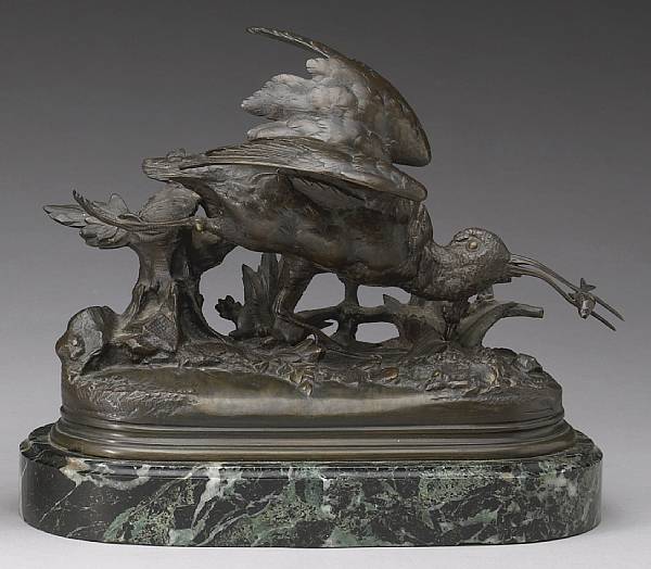 Appraisal: A patinated bronze figure B casse tenant un poisson cast