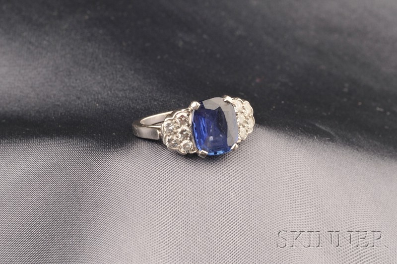 Appraisal: Platinum Sapphire and Diamond Ring prong-set with a cushion-cut sapphire