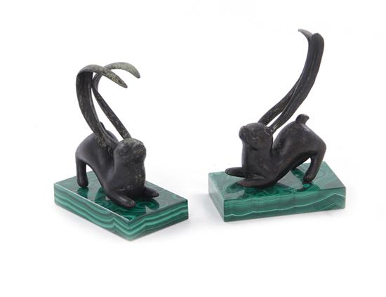 Appraisal: Pair bronze rabbits on malachite bases probably Chinese Qing dynasty