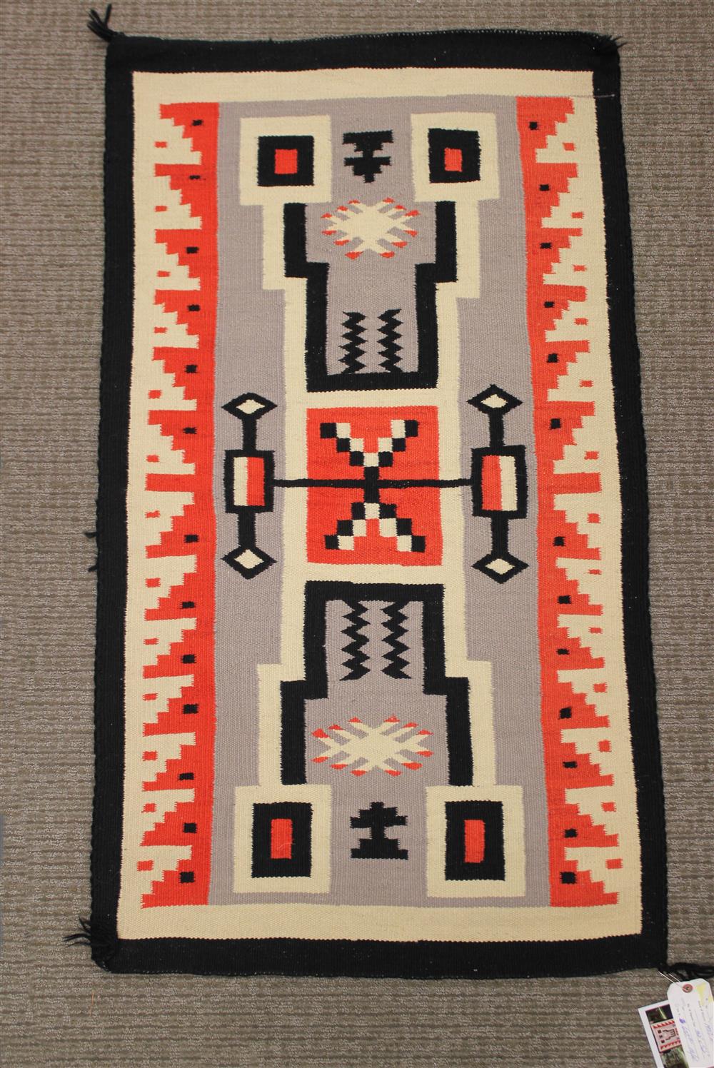 Appraisal: NAVAJO WEAVING natural and analine dyed homespun wool storm pattern