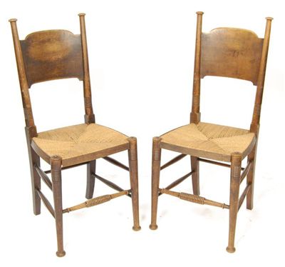 Appraisal: A pair of Arts and Crafts William Birch oak chairs