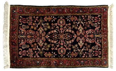 Appraisal: Sarouk rug typical floral designs on blue black field ft