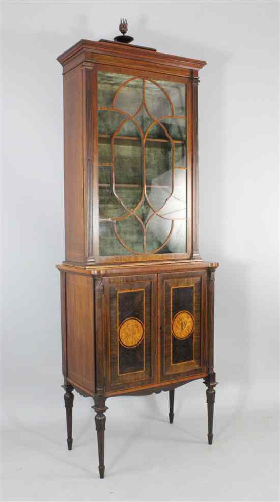 Appraisal: An Edwardian inlaid mahogany display cabinet with astragal glazed door