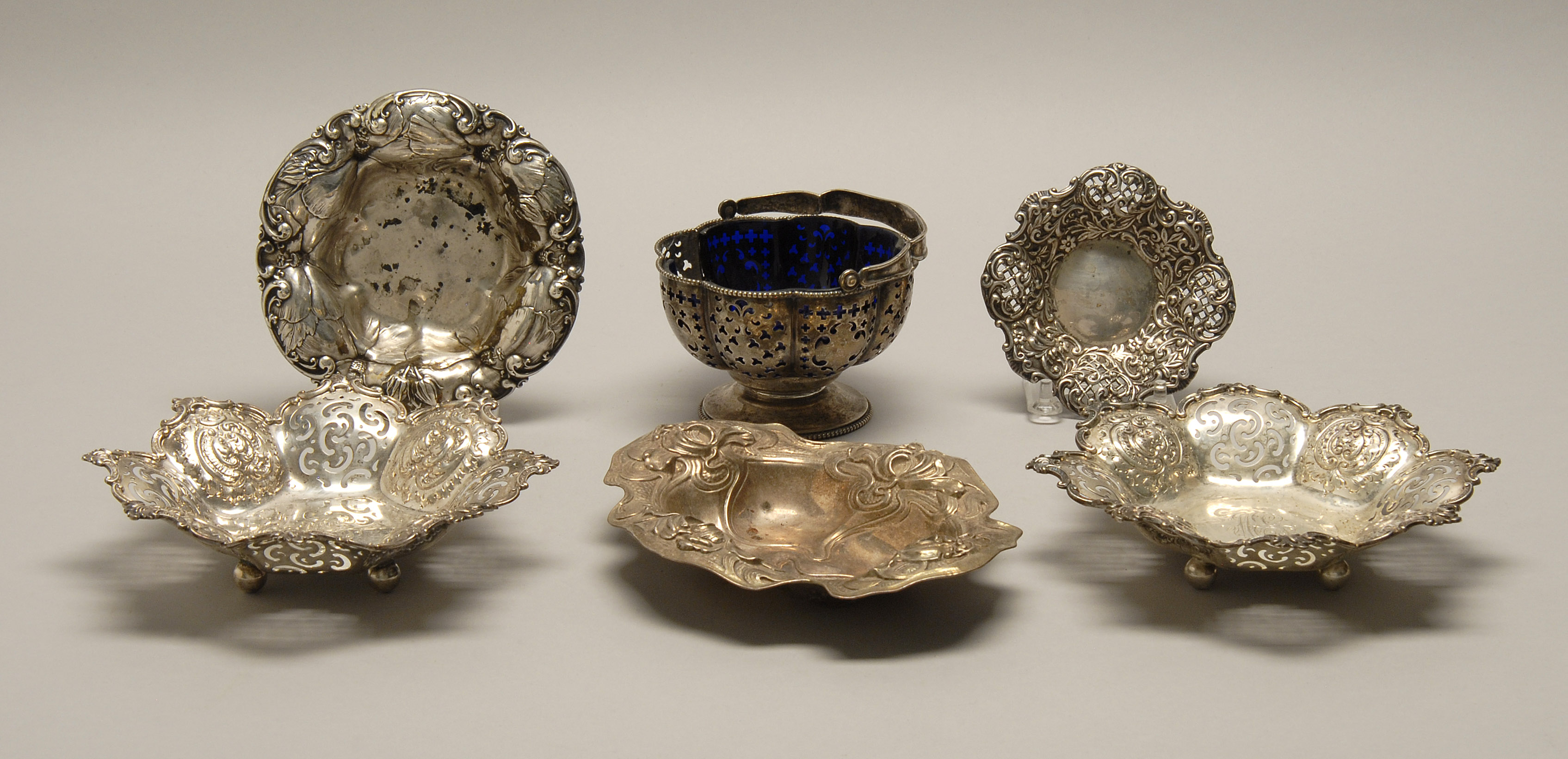 Appraisal: FIVE STERLING SILVER CANDY DISHES AND A CANDY BASKET Late