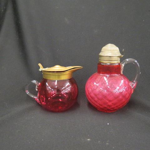 Appraisal: Victorian Cranberry Art Glass Syrup Pitchers one is diamond quilted