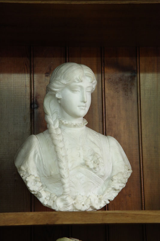 Appraisal: MARBLE BUST Classical woman with braided hair and floral accents