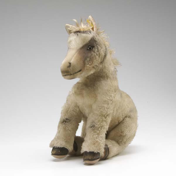 Appraisal: STEIFF DONKEY With mottled fur glass eyes and bound leather