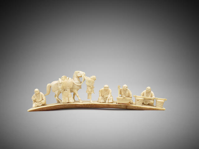 Appraisal: A Japanese ivory okimono of awaiting servants Meiji to Taiso