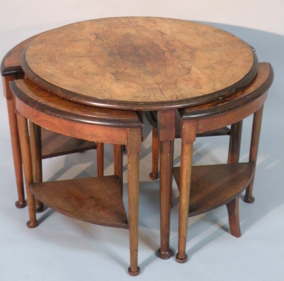 Appraisal: A 's walnut occasional nest of tables the circular top