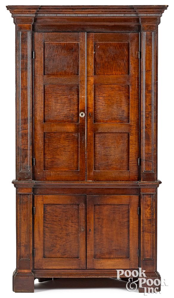 Appraisal: Pennsylvania tiger maple one-piece corner cupboard Pennsylvania tiger maple one-piece