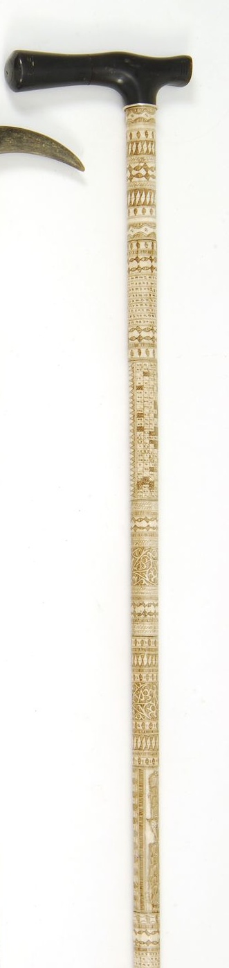 Appraisal: ROSEWOOD AND CARVED BONE CANE th CenturyCarved bone handle in