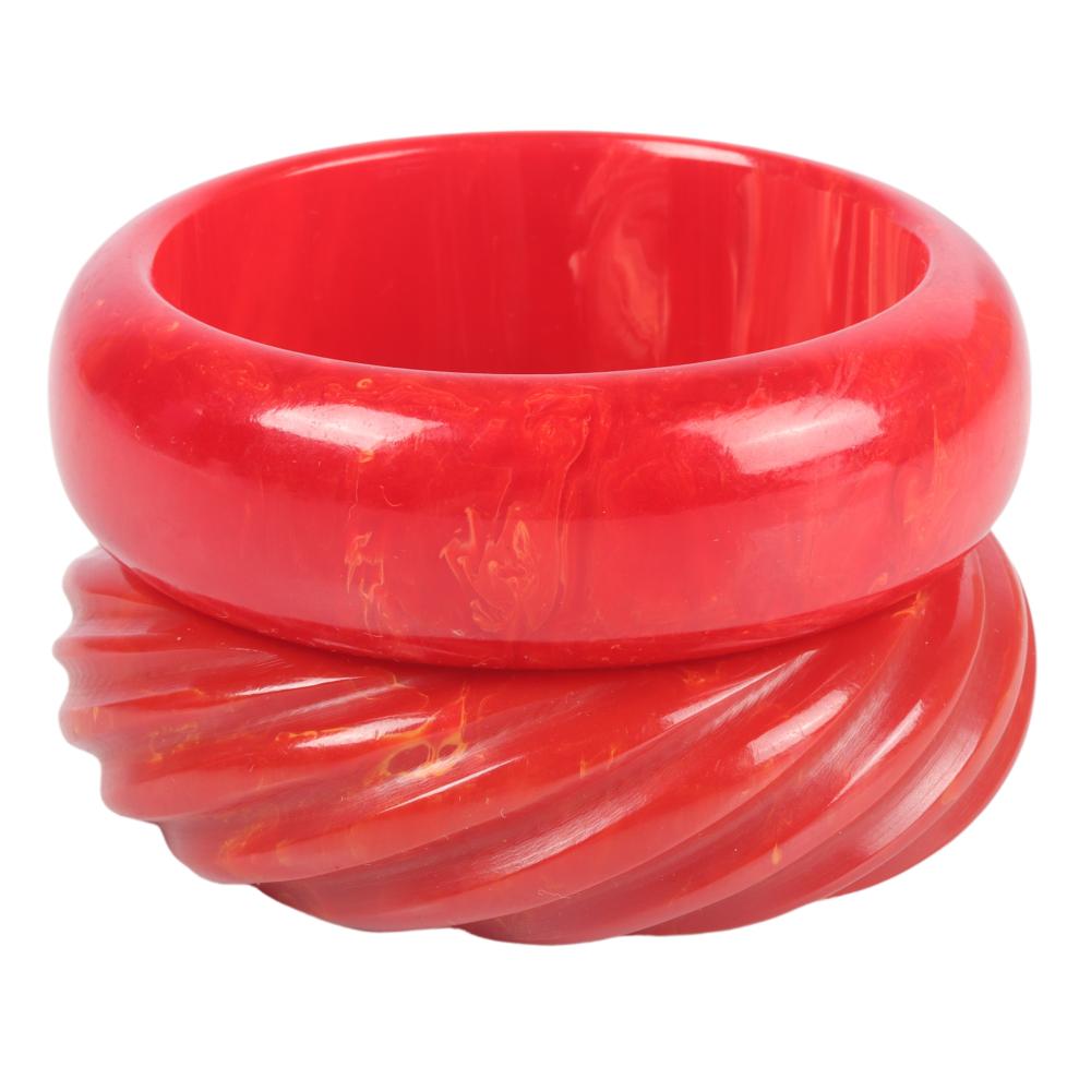 Appraisal: TWO RED BAKELITE BANGLE BRACELETS INNER WIDTH WTwo red Bakelite