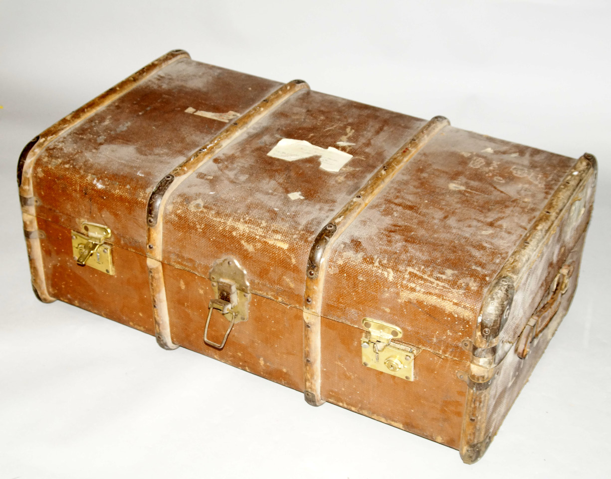 Appraisal: A vintage canvas bound cabin trunk with brass fittings