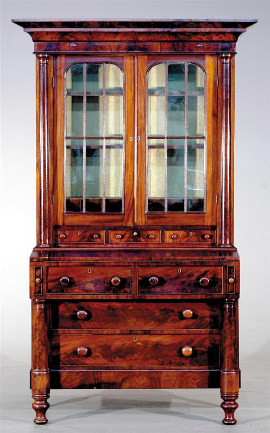 Appraisal: American Empire mahogany secretary bookcase circa heavy molded cornice over