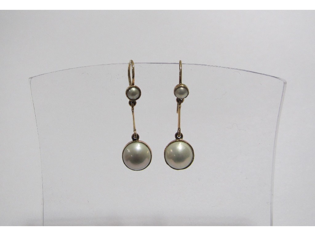 Appraisal: A pair of Edwardian gold and pearl drop earrings with