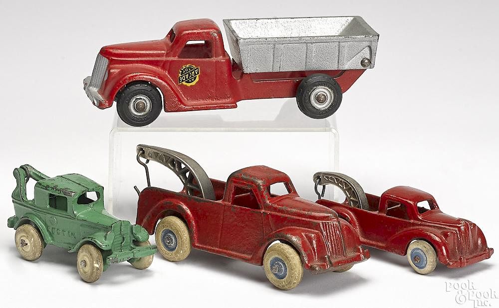 Appraisal: Four small Arcade cast iron vehicles Four small Arcade cast