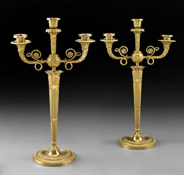 Appraisal: A pair of Empire style gilt bronze three light candelabra