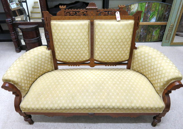 Appraisal: A VICTORIAN EASTLAKE STYLE SETTEE American c with carved walnut