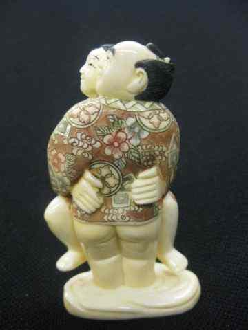 Appraisal: Chinese Carved Hippo Ivory Erotic Figurine man woman embraced fancy