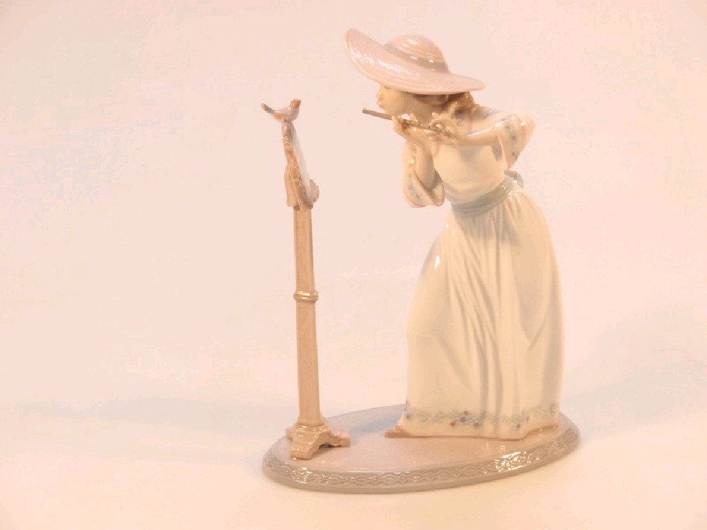 Appraisal: A Lladro figure of a young flautist standing before a