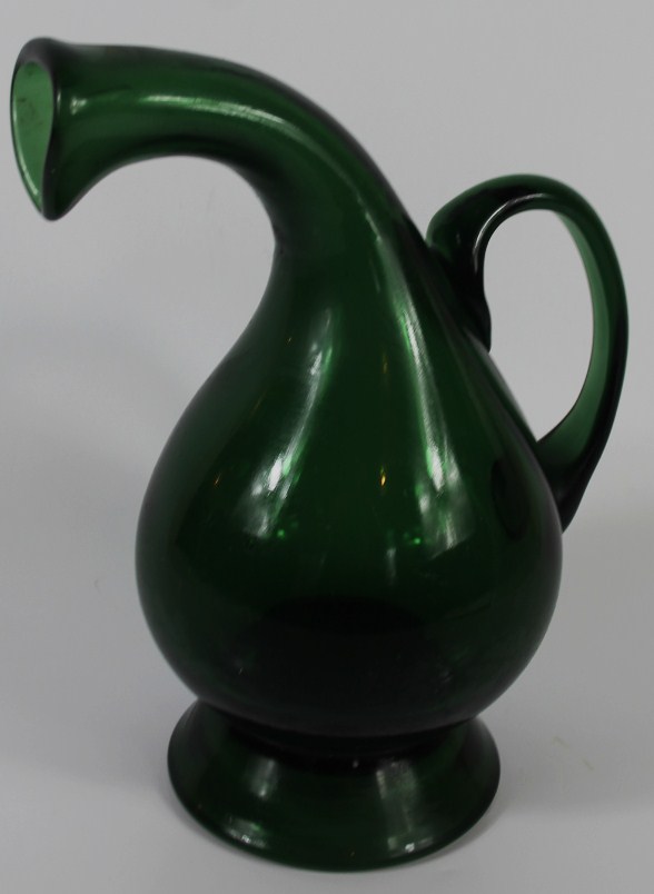 Appraisal: A Victorian green glass footed pear shaped water jug cm