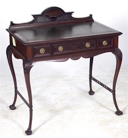 Appraisal: CHIPPENDALE REVIVAL MAHOGANY WRITING TABLE with pierced shelved superstructure above