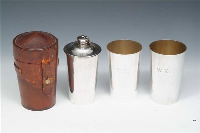 Appraisal: A SILVER PLATED BRITANNIA METAL FLASK and two beakers in