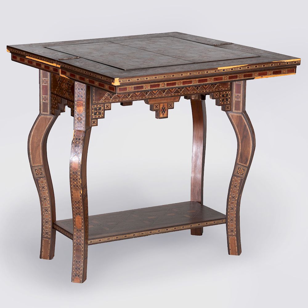 Appraisal: Moroccan Mother-of-Pearl Inlaid Exotic Wood Games Table The hinged top