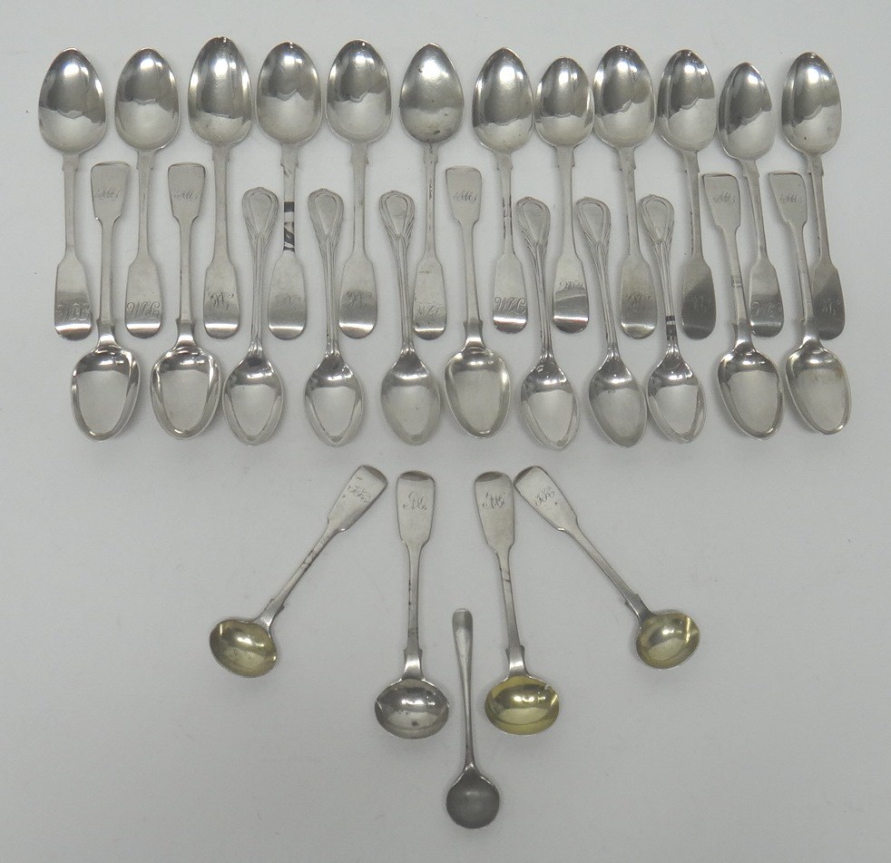 Appraisal: A set of six silver teaspoons with decorated handles Sheffield