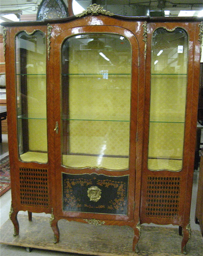 Appraisal: LOUIS XV STYLE BREAKFRONT CHINA DISPLAY CABINET of kingwood and