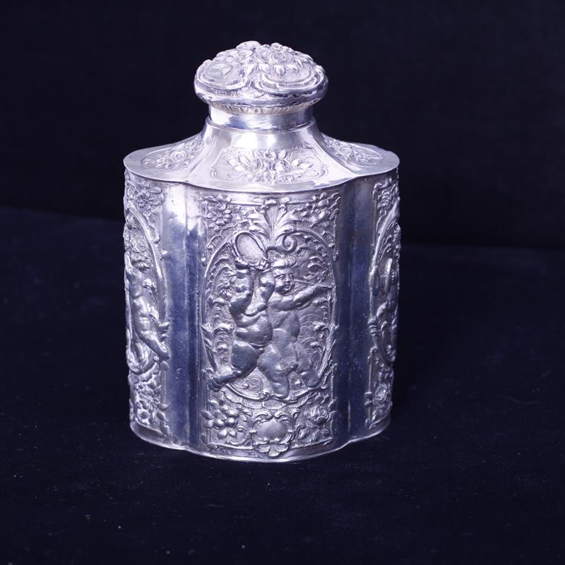 Appraisal: German silver repousse tea caddy with cherub musician figures in