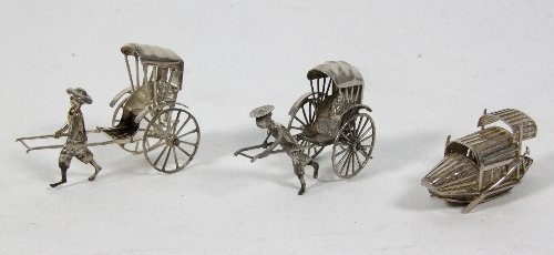 Appraisal: A Chinese silver model of a rickshaw puller Cumwo Hong