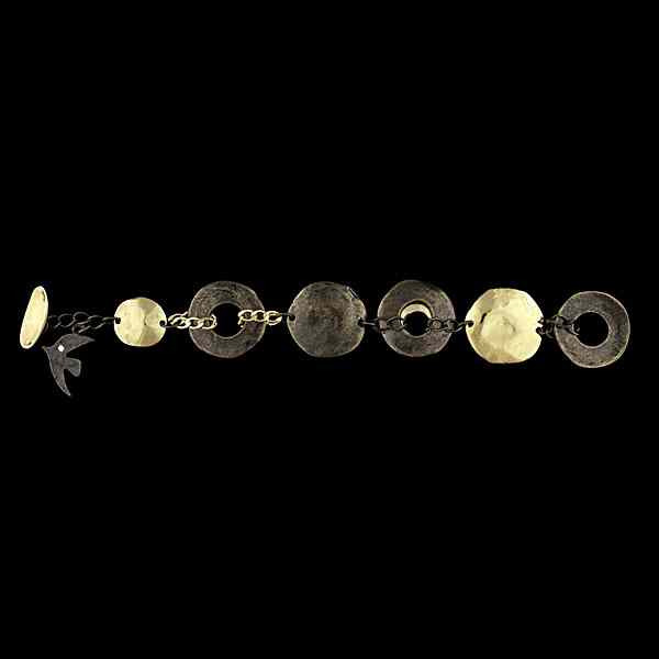 Appraisal: C cile Jeanne Hammered Charm Bracelet French hand-hammered gold tone