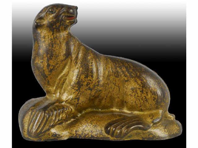 Appraisal: Cast Iron Sea Lion Still Bank Description Seal on Rock