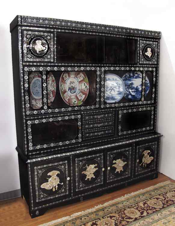 Appraisal: CHINESE MOTHER OF PEARL INLAID DISPLAY CABINET Black lacquer with