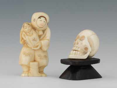 Appraisal: A Carved Ivory Netsuke Skull and Figure Holding a Baby