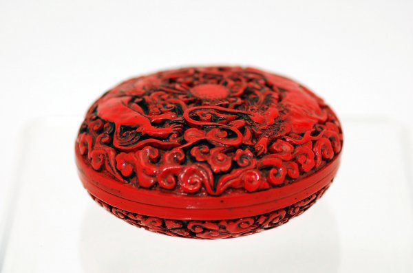 Appraisal: Lidded cinnabar box th century lid carved with two dragons