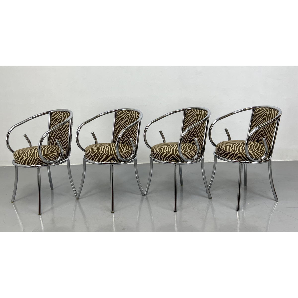 Appraisal: Set Chrome Tube Frame Arm Dining Chairs Faux Zebra Patterned