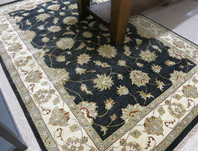 Appraisal: HAND KNOTTED ORIENTAL CARPET Persian Isfahan design featuring a floral