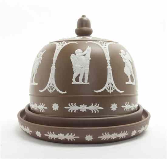 Appraisal: A Jasperware Cheese Dome modeled with classical putti in white