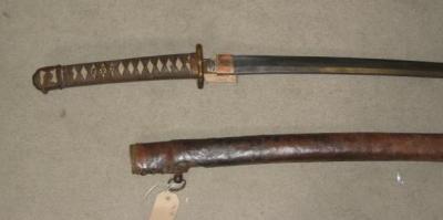 Appraisal: A JAPANESE OFFICER'S KATANA c with fish-skin grip bound with