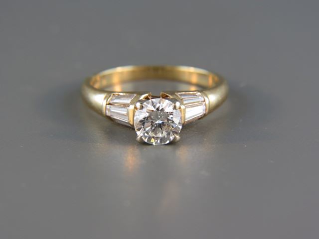 Appraisal: Diamond Ring carat round brilliant with six baguette diamonds totaling