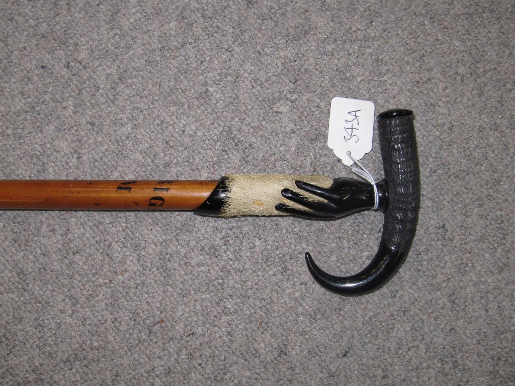 Appraisal: Walking stick with Bakelite handle modelled as a hand grasping