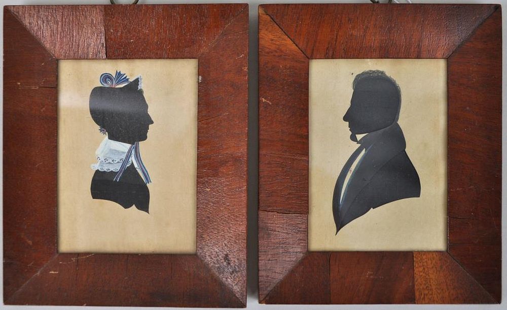 Appraisal: Pair Antique Hollow Cut Silhouette Portraits cut paper over fabric