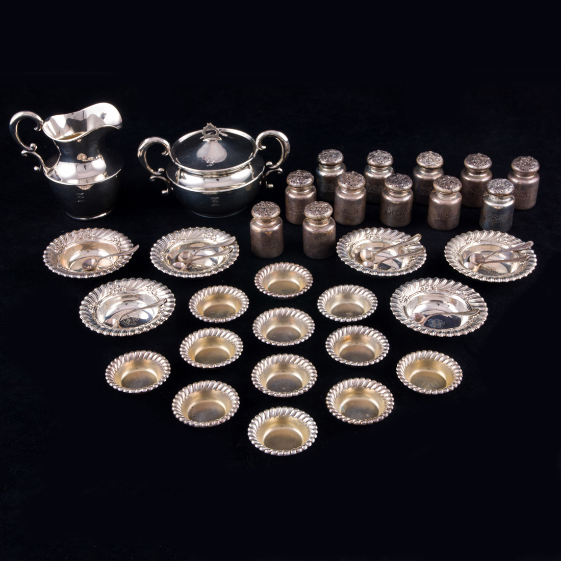 Appraisal: AN ASSEMBLED SHREVE CO STERLING TABLE SERVICE SALTS SHAKERS CREAMER