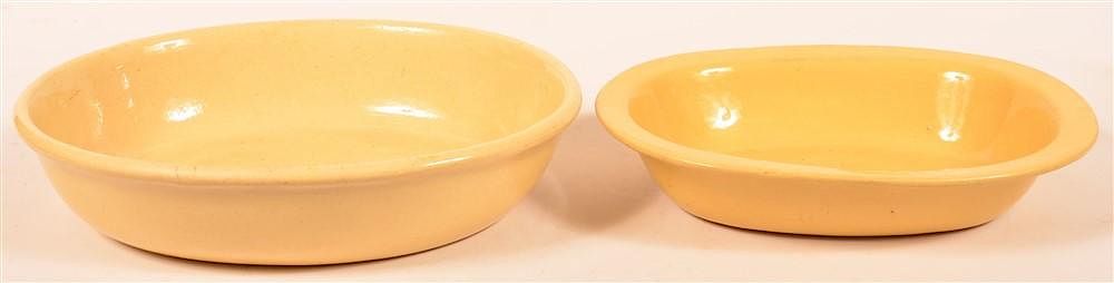 Appraisal: Yellowware Vegetable Bowls or Baking Dishes Two Yellowware Oval Vegetable