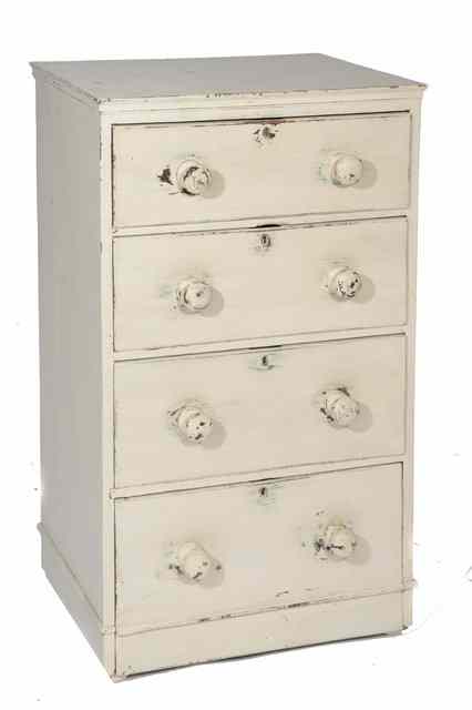 Appraisal: A VICTORIAN PINE TALL CHEST of four drawers with turned