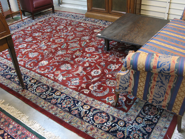 Appraisal: HAND KNOTTED ORIENTAL CARPET overall floral design on red ground