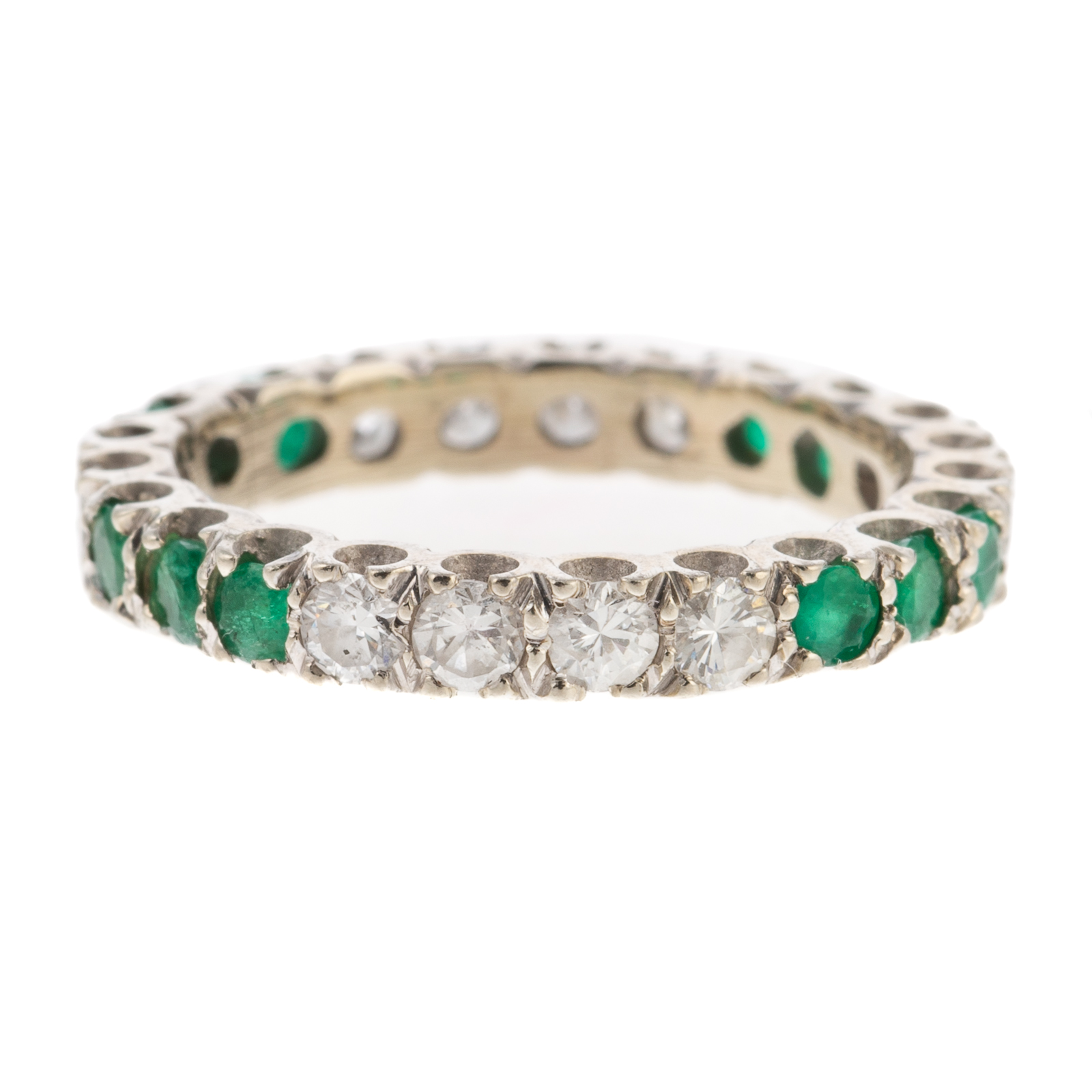 Appraisal: AN EMERALD DIAMOND ETERNITY BAND IN K K white gold