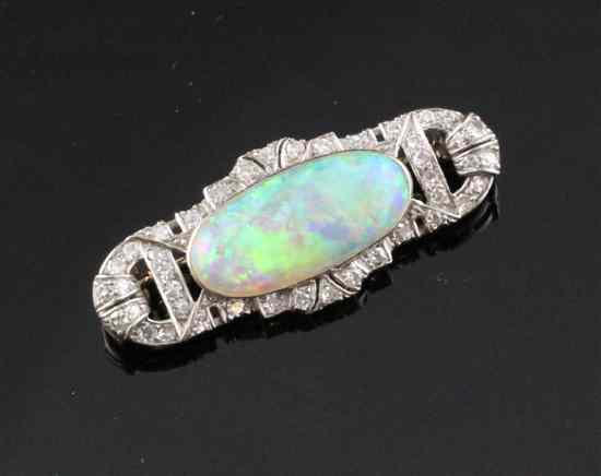 Appraisal: A 's ct white gold diamond and white opal brooch